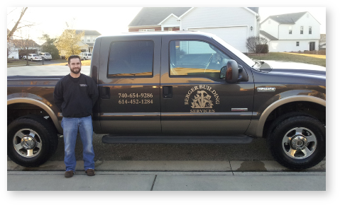 man standing next to truck